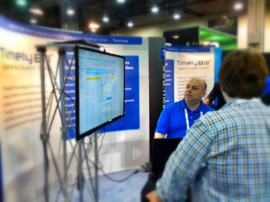 Michael Lates, demos TimelyBill on the floor at Comptel PLUS in Dallas